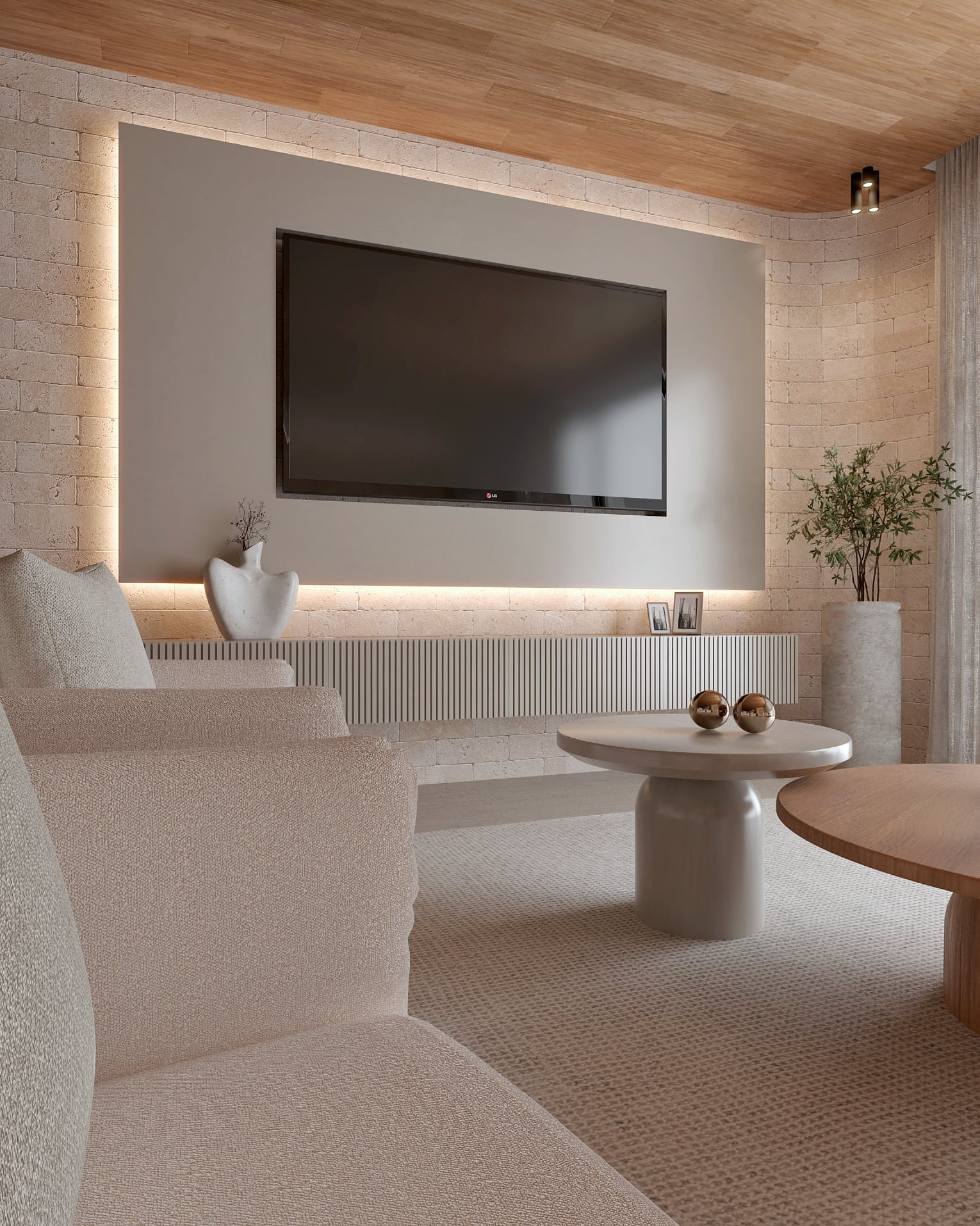 Sala de TV com painel iluminado e revestimento em pedra, projeto de Vitória Duarte Arquitetura